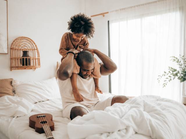 Family laughing together during a lifestyle photo session